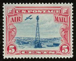 This 5¢ Beacon airmail stamp was issued on July 25, 1928, showing a plane flying over Sherman Hill in red and blue ink. It was part of the U.S. effort to popularize air mail.