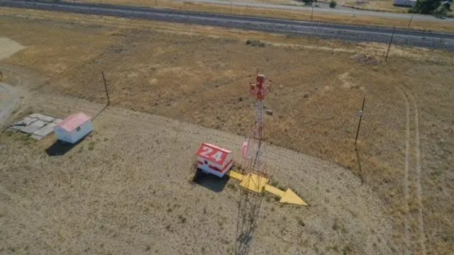 This concrete arrow in Dubois, Idaho is part of a surviving aviation navigation site from the late 1920s and early 1930s. The photo was taken in 2018, facing southwest.