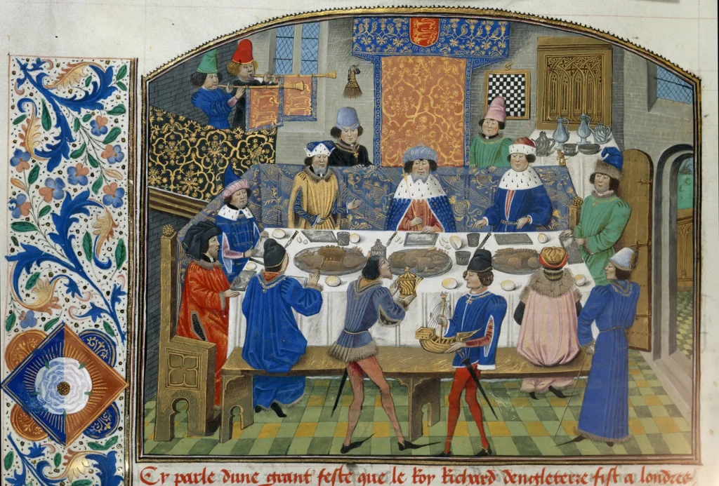 King Richard II dines with the Dukes of York, Gloucester, and Ireland in this illustrated scene from a 15th-century Flemish manuscript.
