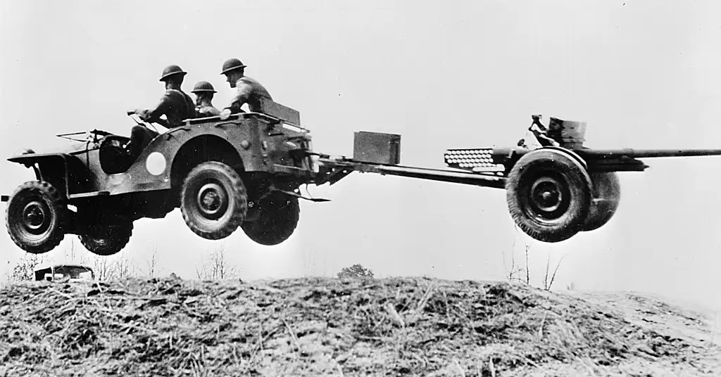 During early testing in 1941, a Bantam jeep launched into the air at New River, North Carolina, towing a 37mm antitank gun behind it. This image later inspired the famous “Flying Jeep” posters.
