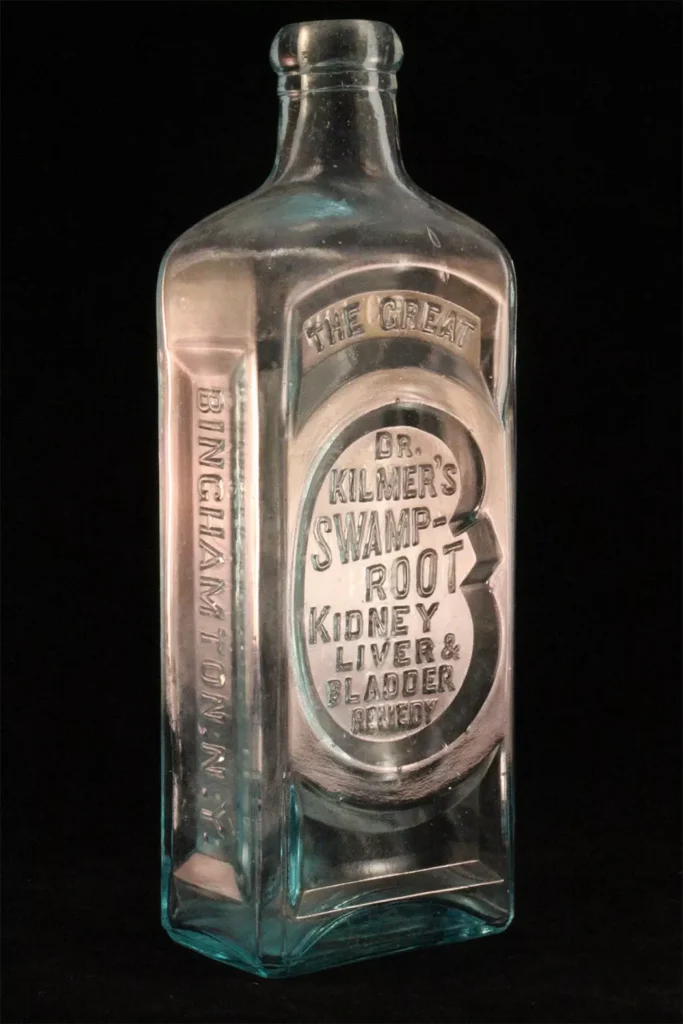 This glass bottle once held Dr. Kilmer’s Swamp Root Remedy, a popular patent medicine in the early 20th century. 