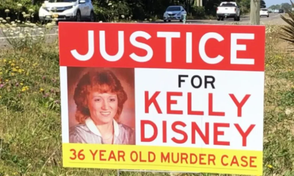 Poster reading ‘Justice for Kelly Disney’ created by family members in 2020 to raise awareness about her unsolved disappearance and murder in Newport, Oregon.