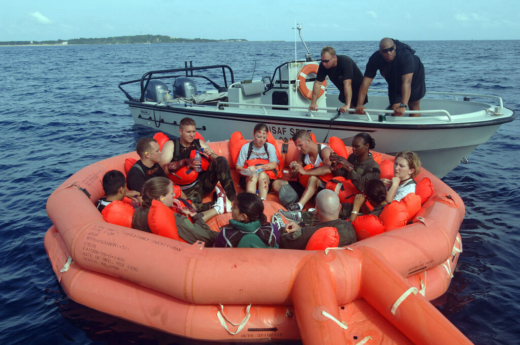 Public domain U.S. Air Force photo of a life raft training exercise, similar to the raft that carried Deborah Scaling Kiley, Brad Cavanagh, and three others during the 1982 Trashman shipwreck.