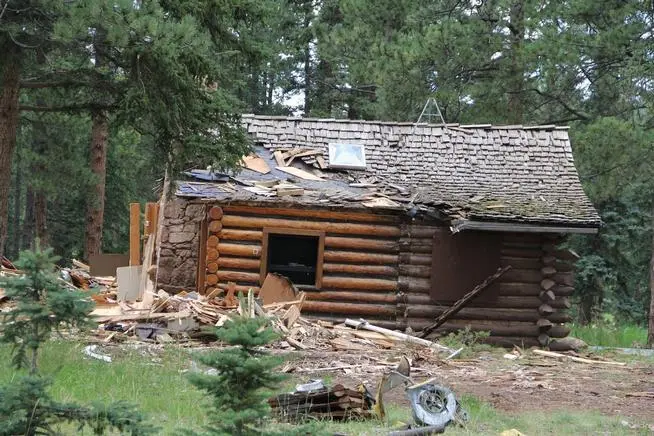 Image of the brick chimney at the abandoned Woodland Park cabin where Joshua Vernon Maddux was found in 2015.