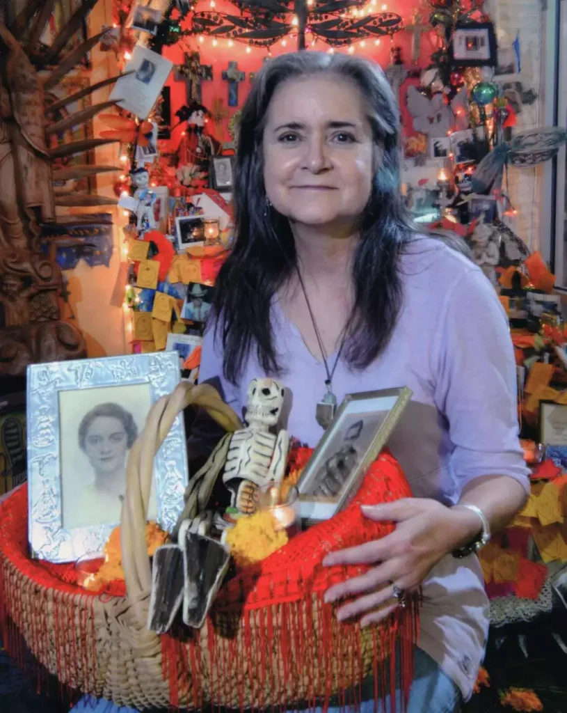 Mary Stewart Cerruti at Casa Ramirez with her handmade Day of the Dead altar honoring her parents.