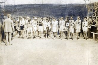 Runners lined up at the start of the 1904 St. Louis Olympic marathon receiving instructions
