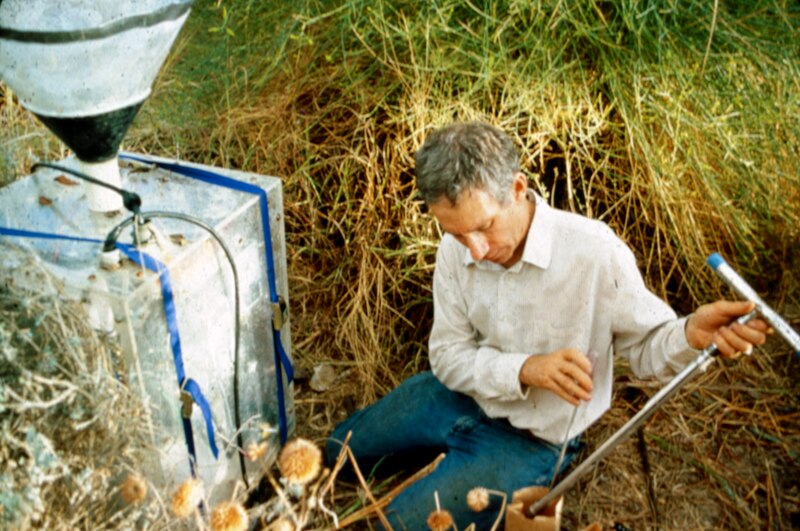 Mark Nelson measuring soil moisture beside a CO2 efflux device inside Biosphere 2 in 1993