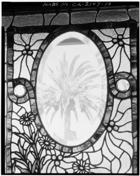 Detail of the daisy patterned stained glass window at the Winchester Mystery House in San Jose California