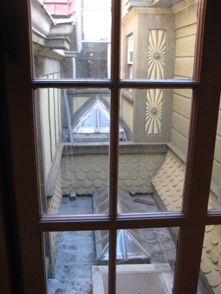 Looking outward through the Winchester Mystery House maze of rooms and architectural details