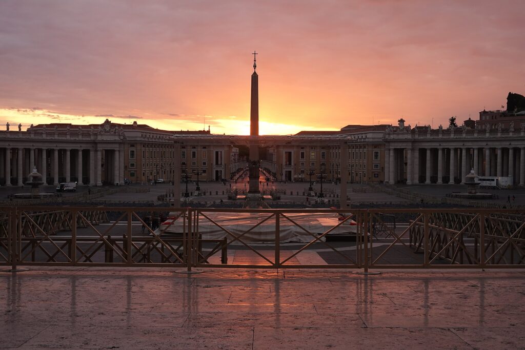 The Vatican Obelisk at sunrise in the centre of St Peter’s Square in Vatican City, showing its modern setting and lasting presence