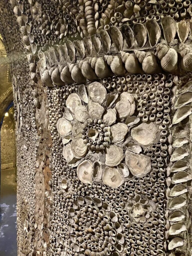 Shell encrusted medallions on the wall of the Margate Shell Grotto in Kent