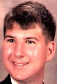 Zebb Quinn headshot. He is smililing. It is likely high school graduation picture.