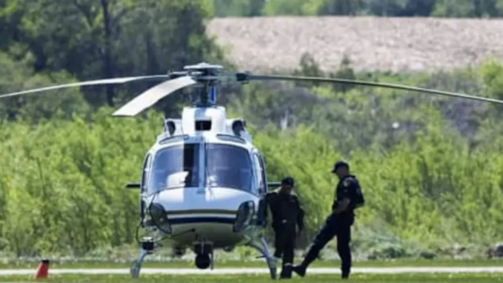 Helicopter deployed in search of Tori Stafford's remains. The accused, Terri McClintic accompanies law enforcement officials in the search.