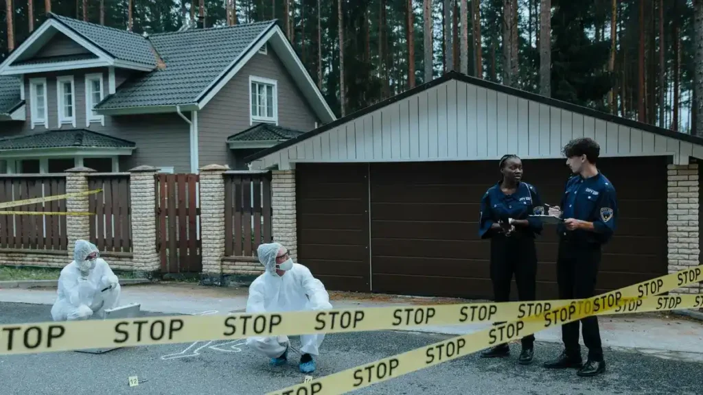 Law enforcement restricts entry into the crime scene; Bobbie Jo Stinnett's home.