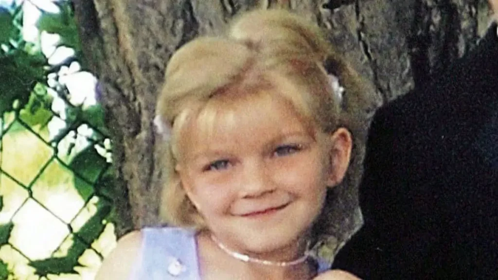 8 year old Tori Stafford poses for a family photograph.