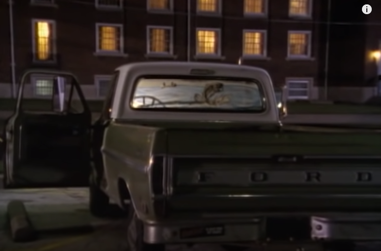 Rear view of an older green Ford pickup truck at night, resembling the vehicle described in the Angela Hammond abduction case.