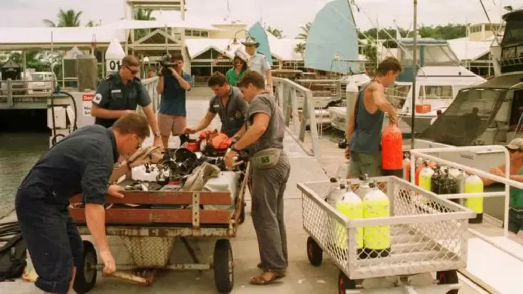 Queensland police and forensic investigators unloading scuba tanks and equipment connected to Tom and Eileen Lonergan.