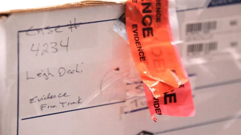 Law enforcement evidence box labelled for the Leigh Occhi investigation and containing items recovered from a vehicle.