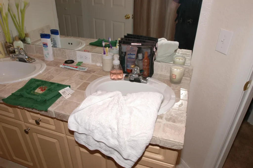 Bathroom sink inside Jennifer Kesse’s Orlando condo, showing personal items left in place after she disappeared.