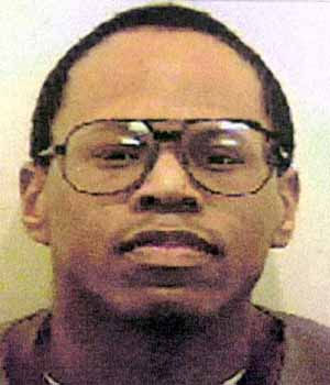Carl Manning wearing large glasses in a headshot photograph; Manning was convicted of murdering Victoria Climbié alongside Marie-Thérèse Kouao.