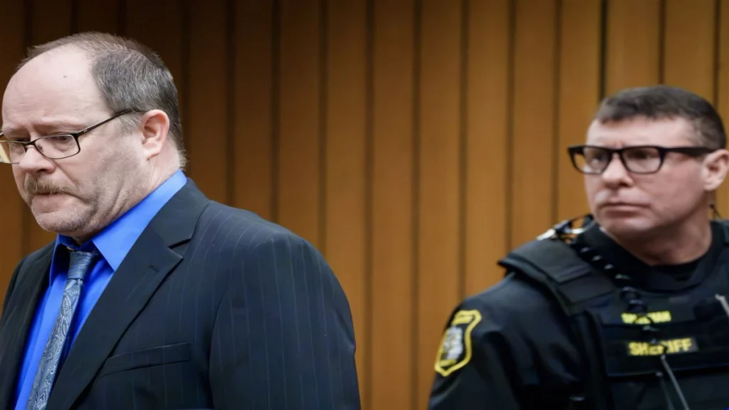 Dale Warner looking down in court during his 2026 murder trial.