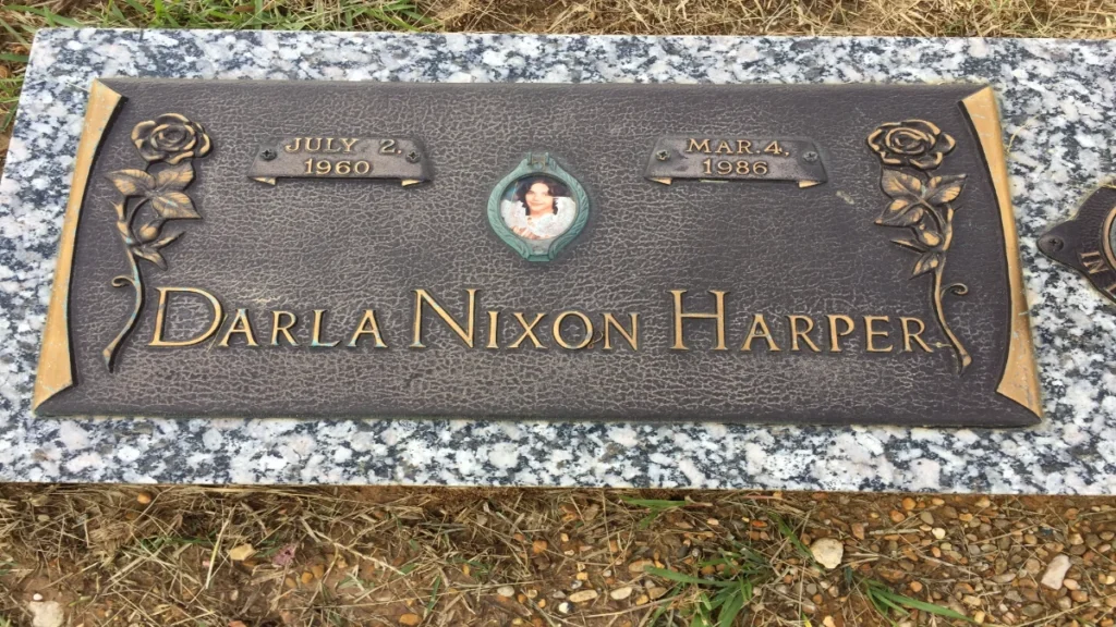 Bronze memorial marker for missing woman Darla Nixon Harper in Sheridan, Arkansas.