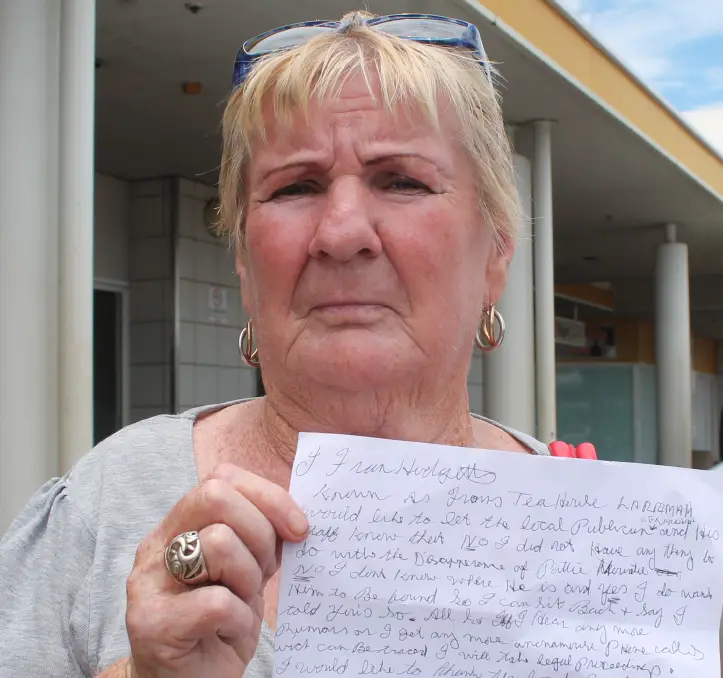 Frances Hodgetts holds up a handwritten letter denying any involvement in the disappearance of Paddy Moriarty.