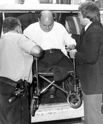 Grady Stiles Jr. being helped from a vehicle outside court during his murder trial.