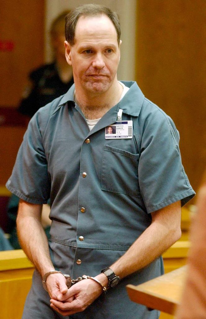Ricky Chavis seated in court during legal proceedings in 2003.