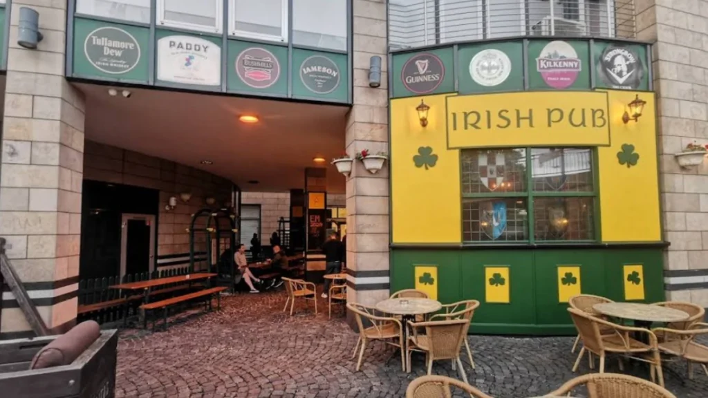 Exterior entrance of The Auld Triangle Irish Pub in Paderborn, Germany.