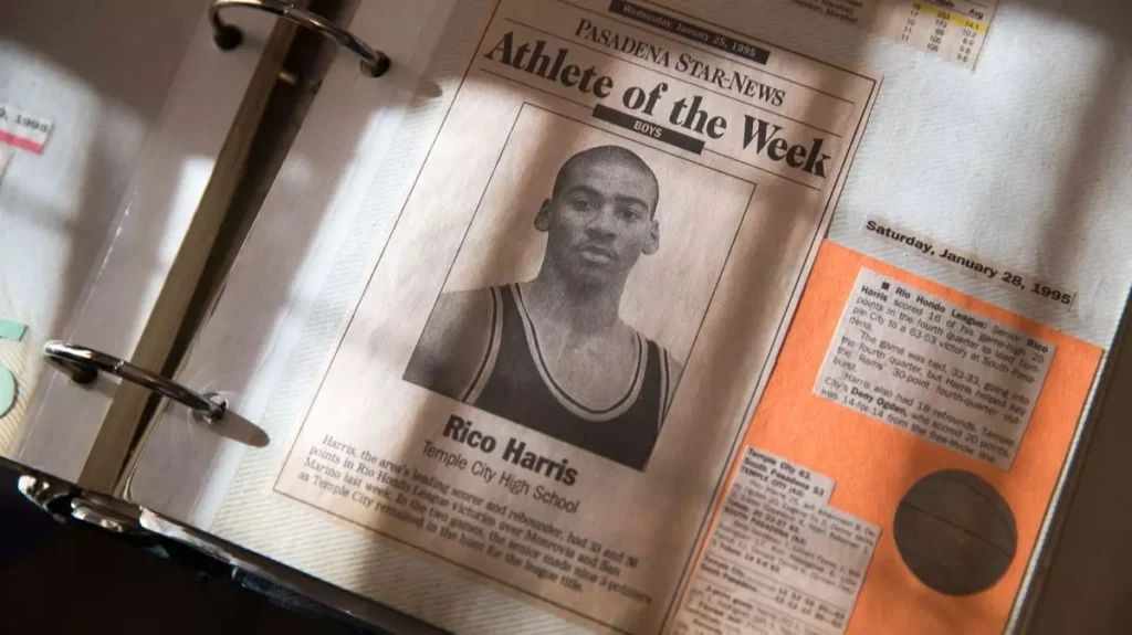 Margaret Fernandez holding a newspaper clipping featuring her missing son, Rico Harris.