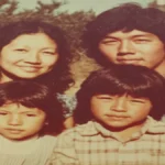 A family portrait of the Jack family—Doreen, Ronald, and their young sons Ryan and Russell