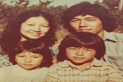 A family portrait of the Jack family—Doreen, Ronald, and their young sons Ryan and Russell