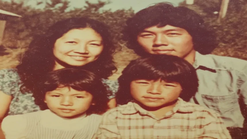 A family portrait of the Jack family—Doreen, Ronald, and their young sons Ryan and Russell