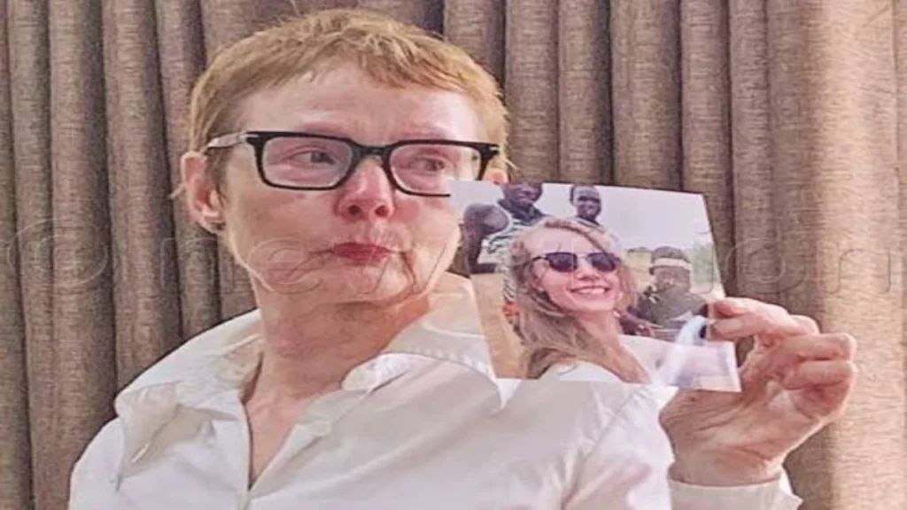 Marije Slijkerman holding a photograph of her missing daughter, Sophia Koetsier, during an appeal for information.