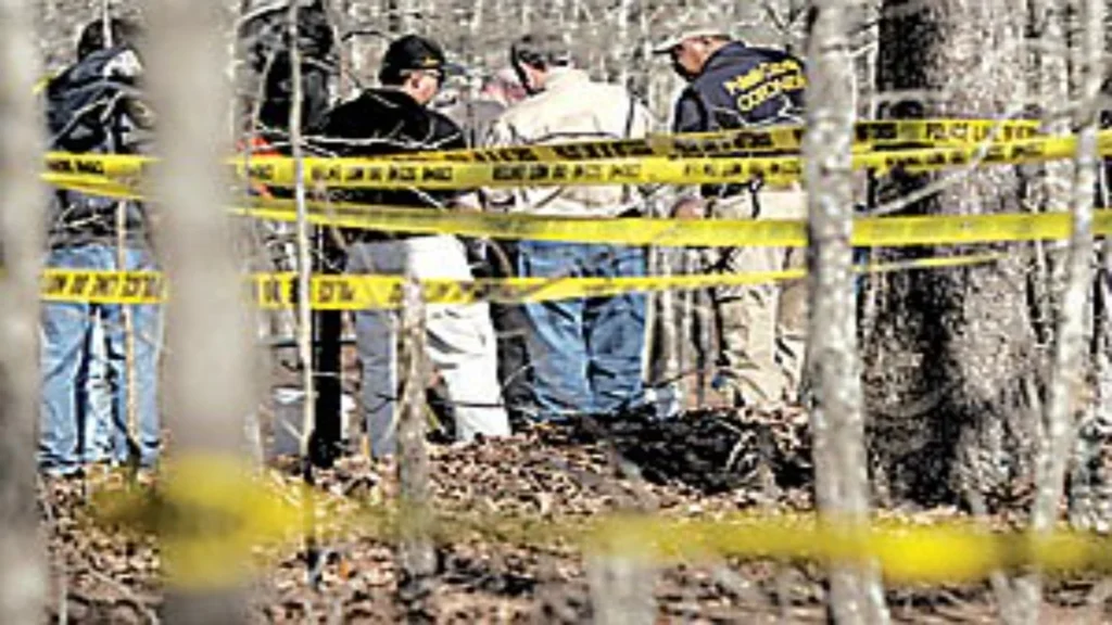 Arkansas investigators examining a suspected grave site in a wooded area of Sherwood during the Darla Harper investigation.