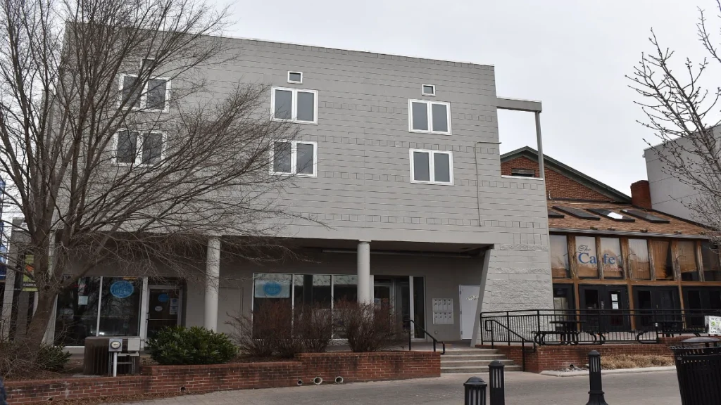 An exterior view of the multi-story commercial and residential building located at 119 North Main Street in downtown Blacksburg, Virginia, which housed the second-floor apartment where the Isimemen Etute incident occurred.
