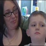 Ena Thomson looks affectionately at her young son, Nathan Thomson