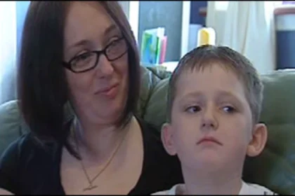 Ena Thomson looks affectionately at her young son, Nathan Thomson