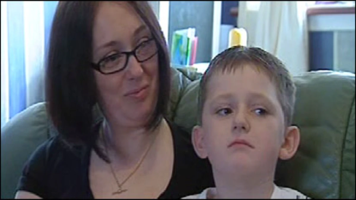 Ena Thomson looks affectionately at her young son, Nathan Thomson