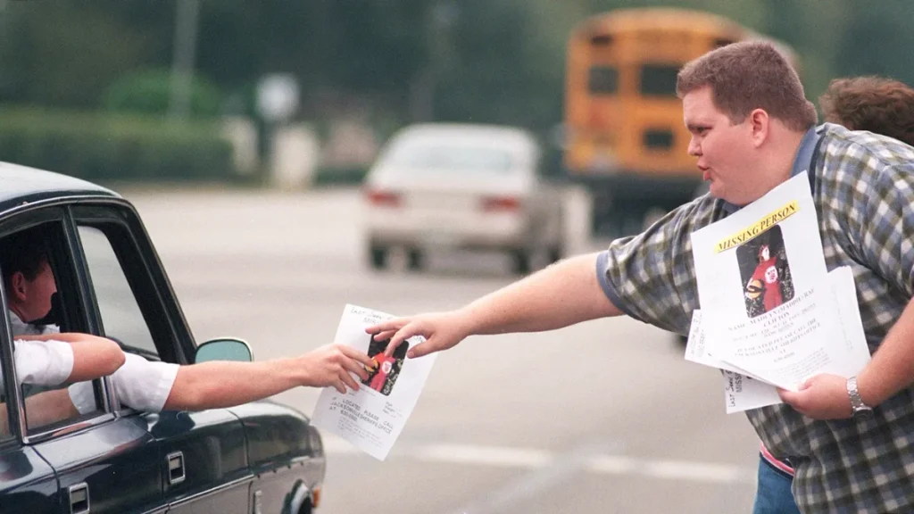 David Hicks distributing missing-person flyers for Maddie Clifton during the 1998 search in Jacksonville.