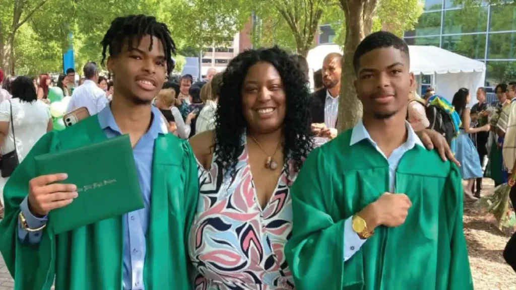 Qaadir and Naazir Lewis celebrating their high school graduation with their aunt Yasmine Brawner.