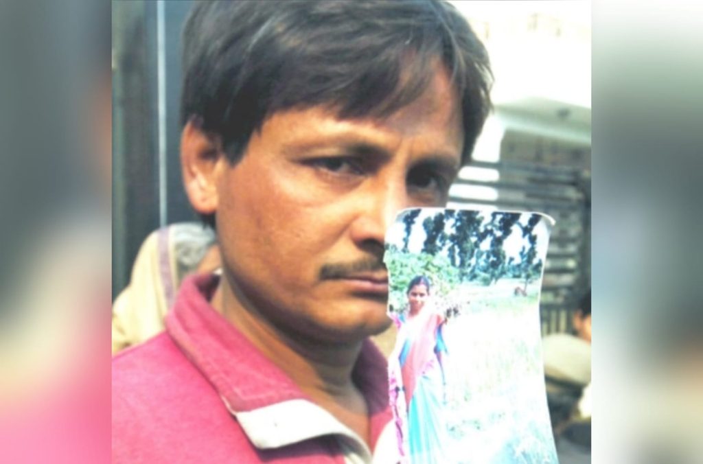 A relative displays a photograph of Payal after her disappearance from Nithari in May 2006. Image taken from The Times of India.