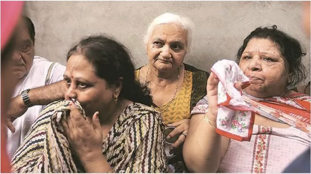 Neighbours gathered outside the Chundawat family home in Burari after 11 relatives were found dead in July 2018.