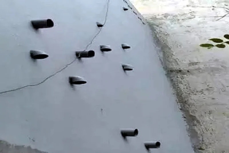 Eleven plastic pipes protruding from the exterior wall of the Chundawat family home in Burari.