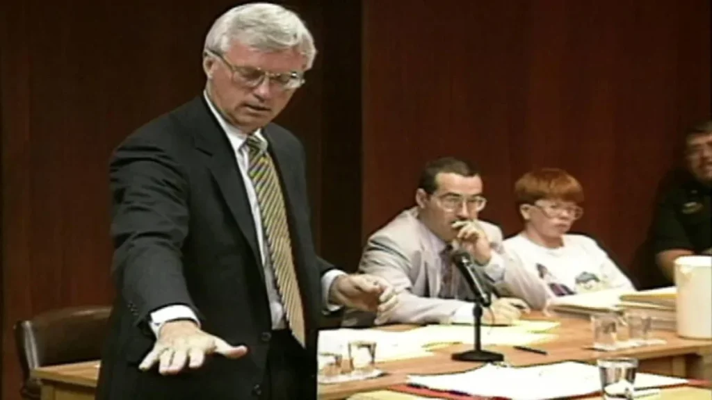 At trial, prosecuting attorney John Tunney motions to show 4-year-old Derrick Robie's height. Eric Smith and his defense attorney Kevin Bradley are at right.