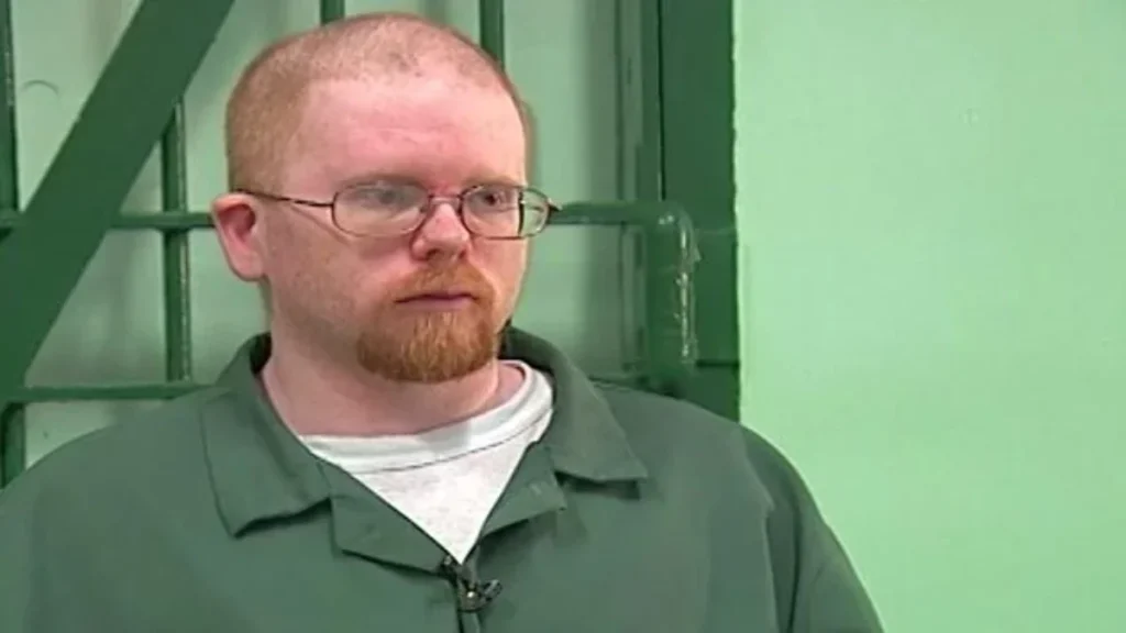 An adult Eric Smith listens to the state parole board during an evaluation hearing inside a New York correctional facility, where he served nearly three decades before being granted release in late 2021.