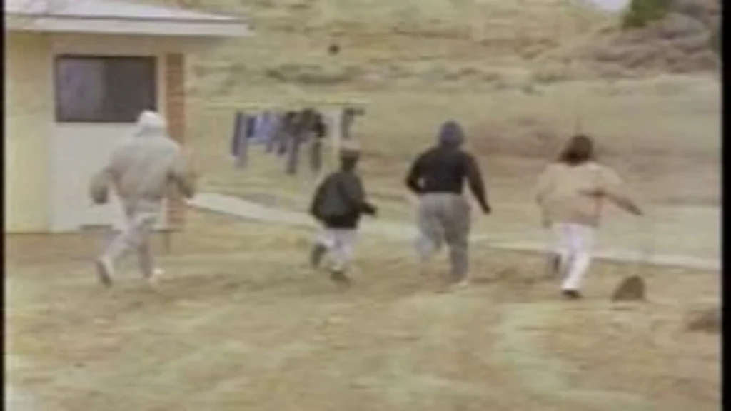 A scene from a television reenactment depicting children running outside the 204 Arnold Circle apartment complex in Gallup, New Mexico, produced for an investigative broadcast on the 1986 disappearance of Anthonette Cayedito.