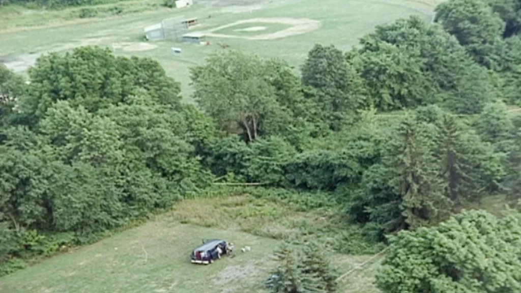 An aerial crime scene photograph from August 1993 showing the wooded thicket in Savona, New York, where four-year-old Derrick Robie was discovered