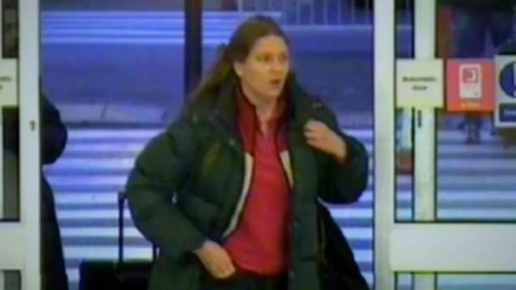 CCTV footage shows Annie Börjesson wearing a dark jacket over a red top as she enters Glasgow Prestwick Airport in Scotland on December 3, 2005, the day before her body was discovered on a nearby beach.